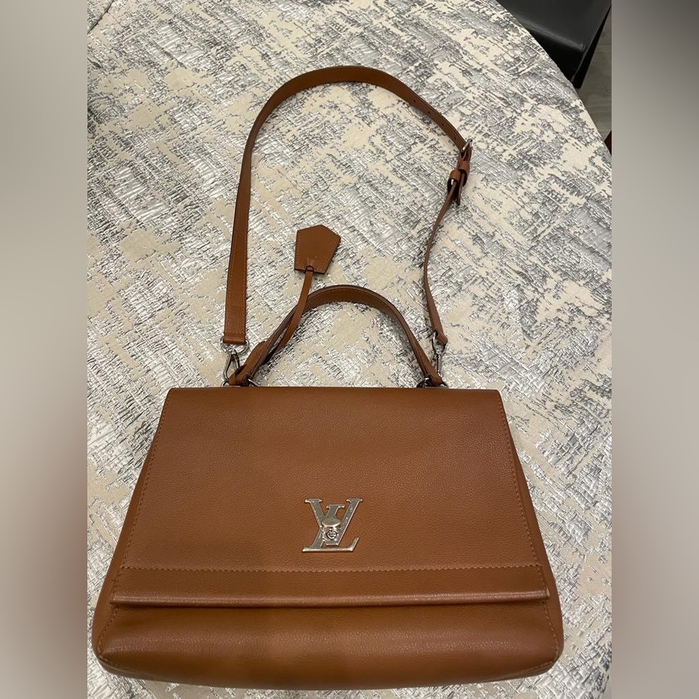 Louis Vuitton brown leather cross body and top handle bag